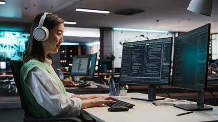 Aufkleber - Female Asian Game Programmer Coding On Desktop Computer In Game Development Studio Diverse Office. Focused Woman Writes Lines Of Code, Does Gameplay Engineering For New Immersive 3D RPG Video Game.