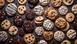 Variety of cookies on dark background, different tastes and color, mostly chocolate or chocolate chips