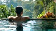 Woman on vacation in pool at luxury spa in Bali.