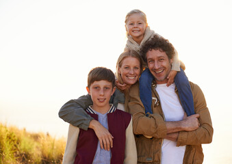 Poster - Family, portrait and smile with field, walk and sunrise for morning exercise and bond. Parents, children and countryside for health, wellness and outdoor adventure at sunset for holiday or vacation.