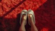 Cozy Home Comfort, Woman in White Slippers, close-up of a woman's feet in soft white slippers on a textured red carpet, symbolizing warmth and home relaxation
