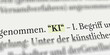 Das Wort KI im Buch mit Textmarker markiert