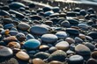 Close-up of pebbles on a quiet beach, washed by moderate waves.