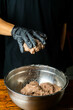 hand mixing ice cold ground meat for sausage until tacky and sticky, home made sausage making