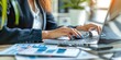 © Serhii - Businesswoman Working on Finance: Woman Accountant Using Calculator and Computer in Office Panoramic Banner