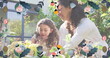 Image of flowers over happy caucasian mother and daughter gardening in sunny garden
