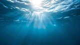 Fototapeta Do akwarium - Sunlight in the Ocean A Glimpse of the Sun's Rays Reflecting on the Water's Surface Generative AI