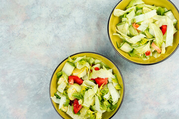 Wall Mural - Healthy green salad with fresh vegetables.