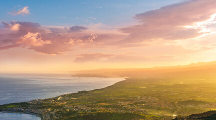 picturesque view to a sunset sea gulf with beautiful mountains and amazing cloudy sky on background of nice travel landscape