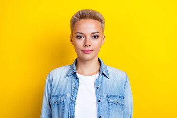 Wall Mural - Photo portrait of attractive young woman look camera shopping promo dressed stylish denim clothes isolated on yellow color background