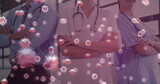 Fototapeta Sypialnia - Image of macro Covid-19 cells floating on a view of a medical staff standing in the background