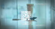 Image of a white QR code scanning over a cup of caffe latte standing on a table in a cafe