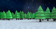 Snow falling over multiple trees on winter landscape against blue shining stars in night sky