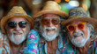 Portrait of three senior friends wearing hats and sunglasses at beach party