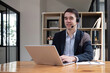 © chartchai - Call center operator or customer service representative with headset sitting at table in office Telemarketing Technical Support Sales Representative