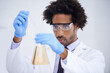 © Katie/peopleimages.com - Man, pipette and flask for science in laboratory, experiment and liquid for biochemistry in container. Black male person, doctor and research for breakthrough, solution and process for medical study