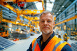 © Helge Kerler - A male worker is standing in a warehouse of photovoltaic panels