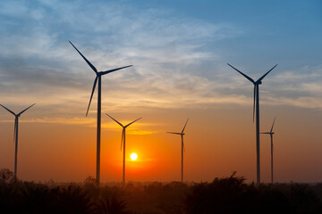 Wall Mural - electric wind turbine farm in the morning.wind energy, electricity production plant. high voltage tr