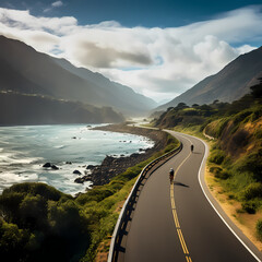 Wall Mural - A cyclist riding along a scenic coastal road. 