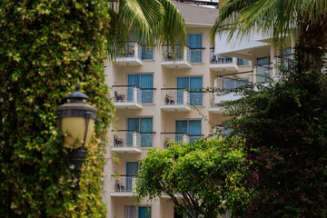 Wall Mural - Southern cityscape, view of buildings and houses in public places in Turkey, sunny summer day in a resort town