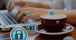 Image of padlock icons, close up of coffee cup, midsection of caucasian man working on laptop