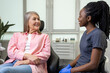 © zinkevych - Dentist woman having conversation with blonde middle aged female patient sitting at dental chair