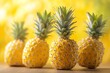 A ripe pineapple stands tall, its spiky green crown and golden colors