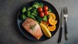 A plate of grilled salmon with fresh vegetables, a delicious and healthy meal option