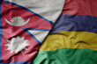 big waving national colorful flag of mauritius and national flag of nepal .