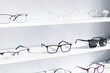 exhibitor of glasses consisting of shelves of fashionable glasses shown on a wall at the optical shop