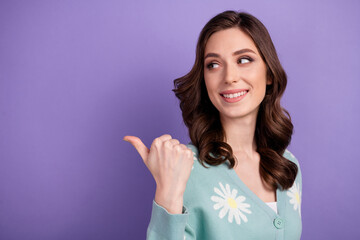 Sticker - Photo of adorable dreamy lady dressed flower print cardigan looking pointing finger empty space isolated violet color background