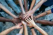 Overhead view of diverse hands together in a symbol of unity and collaboration