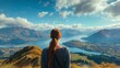 Woman admiring majestic roys peak track landscape overlooking lake wanaka, new zealand