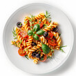 Plate of Italian fusilli pasta salad with cherry tomatoes, black olives, and fresh herbs on a white background, ideal for menu design or culinary blog