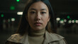 © Yuliia - Close up portrait Asian woman looking at camera unhappy sight sad chinese korean japanese girl female client customer car driver on dark parking underground serious businesswoman lady alone outside