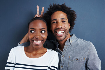 happy, portrait and black couple with peace and love on studio background together with happiness. c