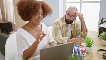 Poster - Serious man and woman coworkers stressed out, working together on laptop at office table