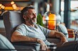 © Maelgoa - Adult man with a relaxed expression, reclining in a lounge chair at the airport lounge, enjoying complimentary refreshments and amenities