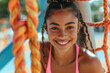 © Zenturio Designs - Young diverse athletic woman wearing pink top at outdoor waterpark. Empty copy space