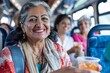 A senior indian woman with a serene smile offering snacks or drinks to fellow passengers on the bus, spreading joy and camaraderie as they all travel towards their vacation destinations together