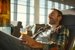 An adult man with a relaxed expression, reclining in a lounge chair at the airport lounge, enjoying complimentary refreshments and amenities