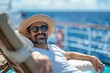 An adult man with a cheerful expression, lounging on a plush sunbed by the pool onboard a cruise ship, the warm rays of the sun and the gentle sea breeze adding to the relaxation