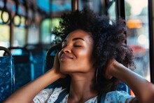 Black woman with a serene smile, closing her eyes and leaning back in her seat on the bus, enjoying a moment of relaxation and tranquility as she begins her vacation journey