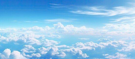 Poster - Vibrant Blue Sky and Fluffy White Clouds Creating a Serene and Peaceful Atmosphere