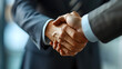 © iPhoto - Professional businessmen handshake image for business purpose. Business contract image.