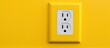 © AkuAku - A yellow wall socket mounted on a yellow wall, blending seamlessly. The rectangular shape of the socket complements the modern font on the wall plate