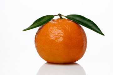 Wall Mural - Tangerine or clementine with green leaf isolated on white background