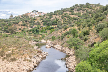 the Erges river with a view of Segura town, municipality of Idanha-a-Nova, province of Beira Baixa, Castelo Branco, Portugal