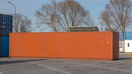 Wall Mural - Long Shipping Container at Terminal Yard