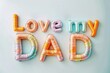 The words love my dad are creatively spelled out using inflated plasticine.